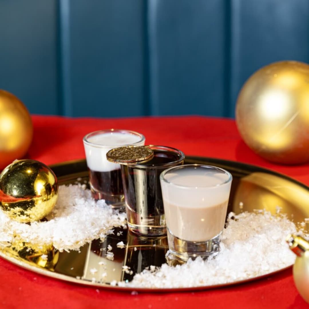 Selection of shots on a tray with chocolate coins